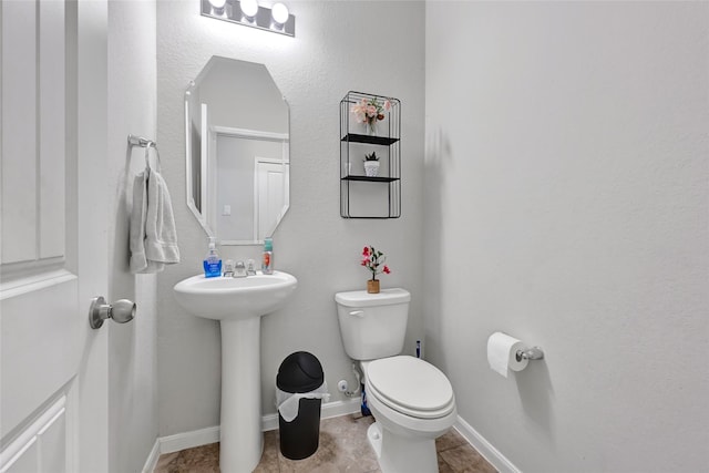 1410 Woods Lake Ct, Houston, TX 77047 - bathroom featuring toilet and a sink