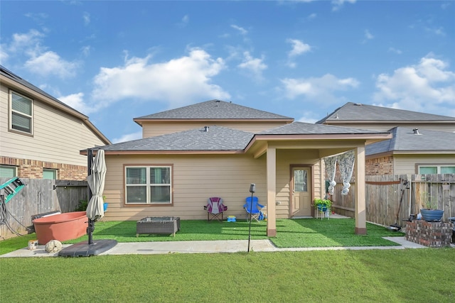 1410 Woods Lake Ct, Houston, TX 77047 - back of house featuring a fenced backyard and roof with shingles