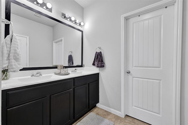 1410 Woods Lake Ct, Houston, TX 77047 - bathroom with double vanity and tile patterned floors