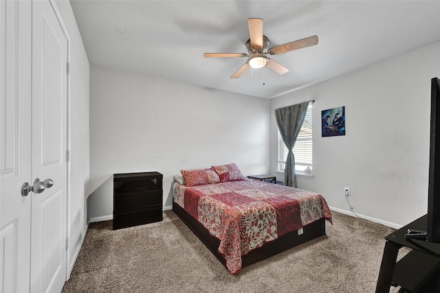 1410 Woods Lake Ct, Houston, TX 77047 - carpeted bedroom with baseboards and ceiling fan