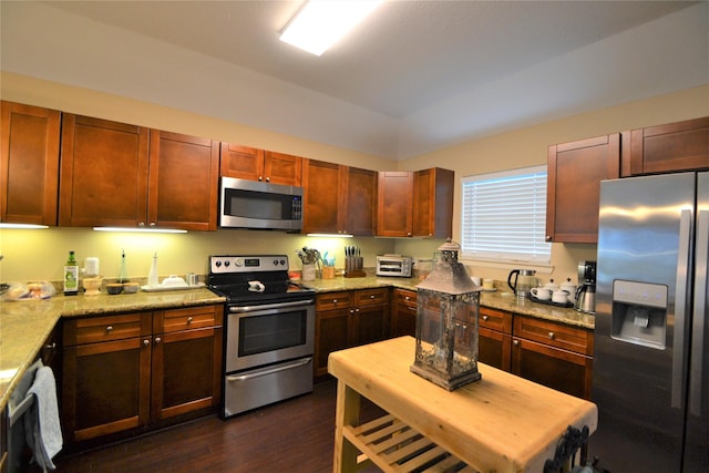 278 Debbie Ln, San Leon, TX 77539 - kitchen featuring appliances with stainless steel finishes, dark wood finished floors, and light stone counters