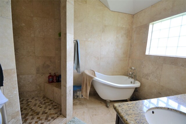 278 Debbie Ln, San Leon, TX 77539 - bathroom featuring tile walls, vanity, a freestanding bath, tiled shower, and tile patterned floors