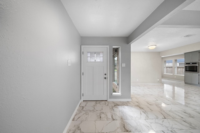 16111 Fan Tail Dr, Crosby, TX 77532 - foyer entrance featuring baseboards and light marble finish flooring