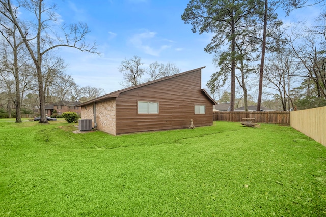 16111 Fan Tail Dr, Crosby, TX 77532 - view of side of home featuring a fenced backyard and a central air condition unit