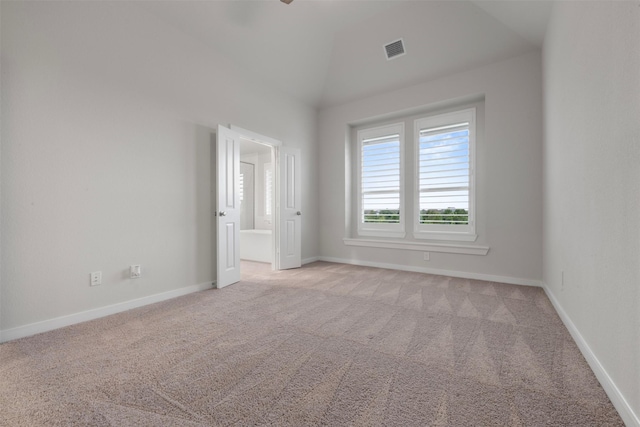 19911 Curved Steel Dr, Cypress, TX 77433 - spare room featuring light colored carpet and vaulted ceiling