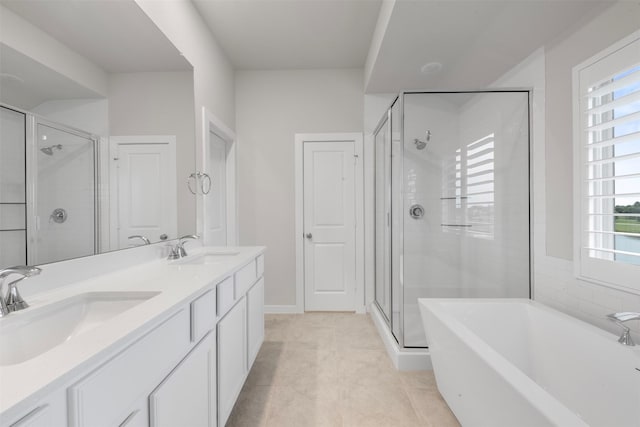 19911 Curved Steel Dr, Cypress, TX 77433 - full bath with a soaking tub, a shower stall, double vanity, and tile patterned floors