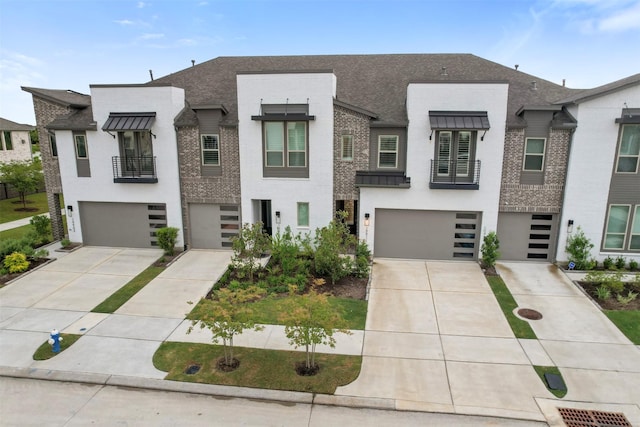 19911 Curved Steel Dr, Cypress, TX 77433 - view of front facade with an attached garage, driveway, and stucco siding