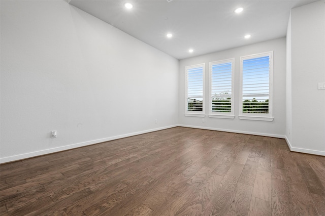 19911 Curved Steel Dr, Cypress, TX 77433 - spare room with dark wood finished floors and recessed lighting