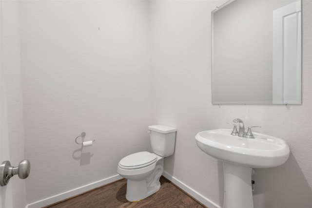 19911 Curved Steel Dr, Cypress, TX 77433 - bathroom featuring wood finished floors and toilet