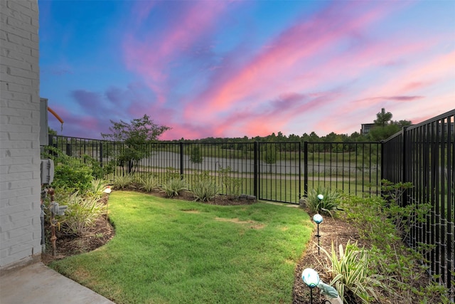 19911 Curved Steel Dr, Cypress, TX 77433 - yard at dusk with a fenced backyard