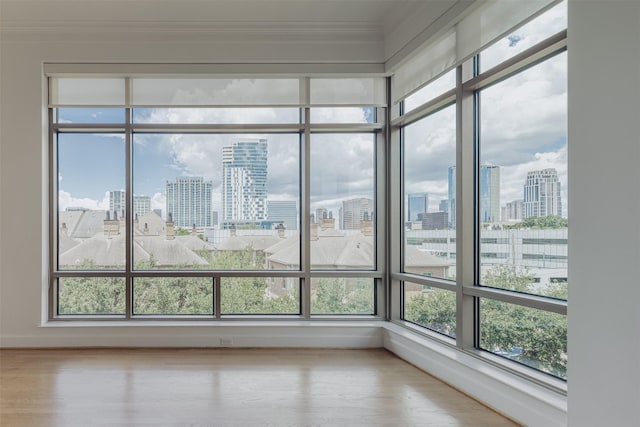 2211 Briarglen Dr Unit 502, Houston, TX 77027 - detailed view of city skyline, crown molding, and wood finished floors