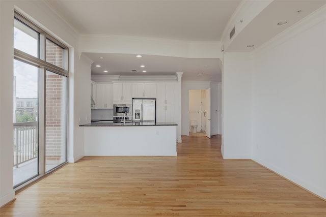 2211 Briarglen Dr Unit 502, Houston, TX 77027 - unfurnished living room with light wood-style floors, crown molding, and recessed lighting