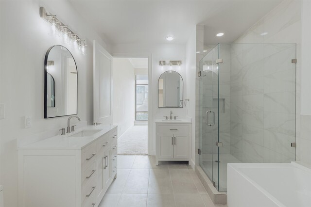 2211 Briarglen Dr Unit 502, Houston, TX 77027 - full bathroom featuring a shower stall, vanity, tile patterned flooring, a tub, and recessed lighting