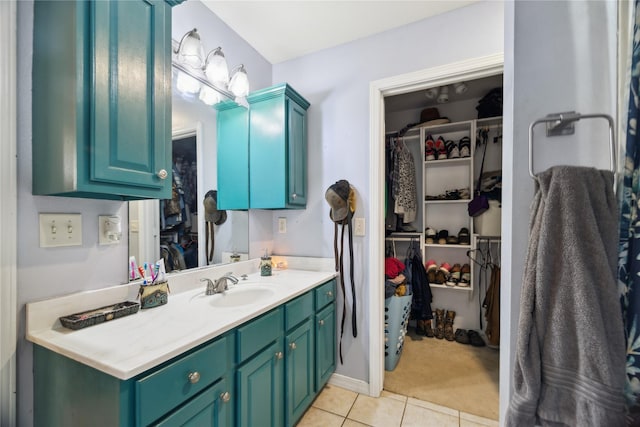 176 Bending Oak, Pollok, TX 75969 - bathroom featuring vanity, tile patterned floors, and a spacious closet