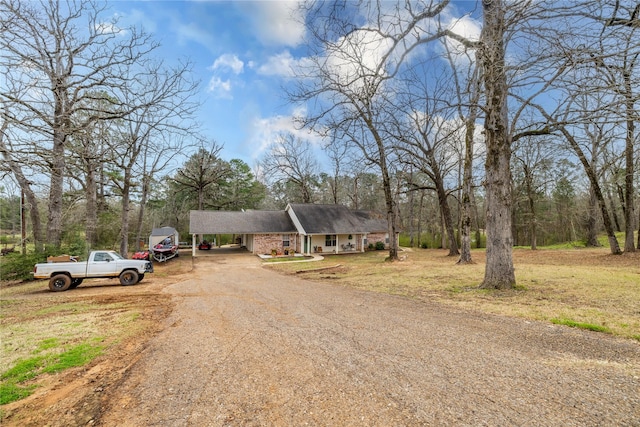 176 Bending Oak, Pollok, TX 75969 - view of front facade with driveway and a carport