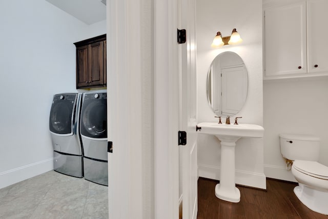 24918 Granite Bluff Ln, Katy, TX 77494 - half bath featuring separate washer and dryer and wood finished floors