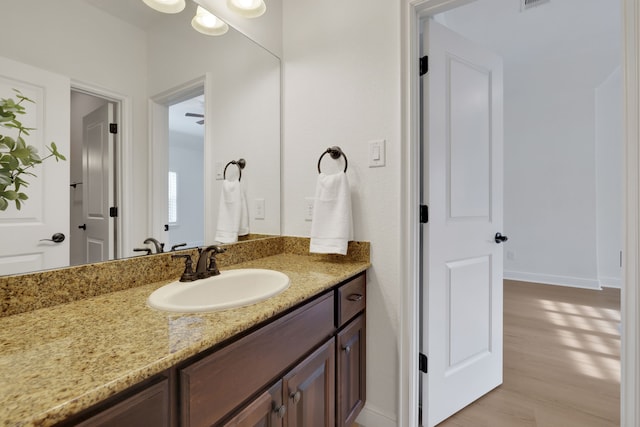 24918 Granite Bluff Ln, Katy, TX 77494 - bathroom with vanity and wood finished floors