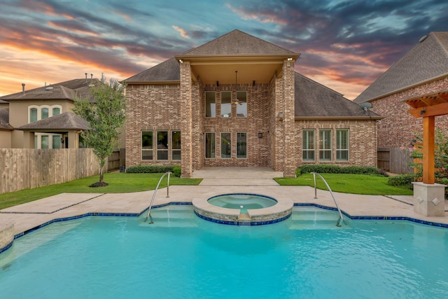 24918 Granite Bluff Ln, Katy, TX 77494 - view of swimming pool featuring a fenced backyard, a patio area, and a pool with connected hot tub