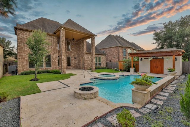 24918 Granite Bluff Ln, Katy, TX 77494 - view of pool with a patio area, a fenced backyard, a pool with connected hot tub, and an outdoor structure