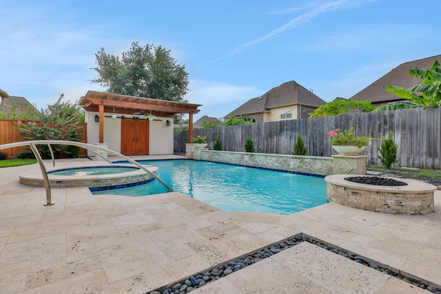 24918 Granite Bluff Ln, Katy, TX 77494 - view of swimming pool featuring a fenced backyard, a patio area, an outbuilding, and a pool with connected hot tub