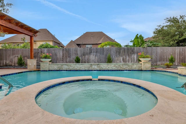 24918 Granite Bluff Ln, Katy, TX 77494 - view of pool featuring a fenced backyard and an in-ground hot tub