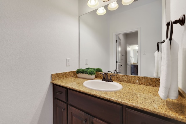 24918 Granite Bluff Ln, Katy, TX 77494 - bathroom featuring vanity and a textured wall