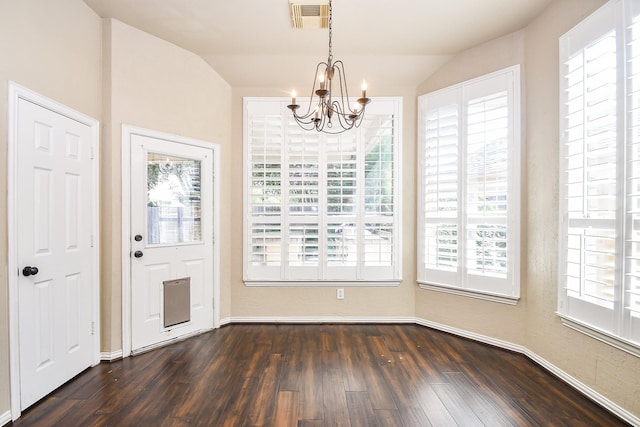22602 Water Edge Ln, Katy, TX 77494 - unfurnished dining area with a chandelier, plenty of natural light, dark wood-style flooring, and lofted ceiling