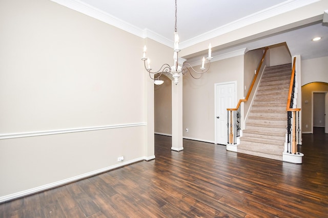 22602 Water Edge Ln, Katy, TX 77494 - empty room with crown molding, stairs, wood finished floors, arched walkways, and a chandelier