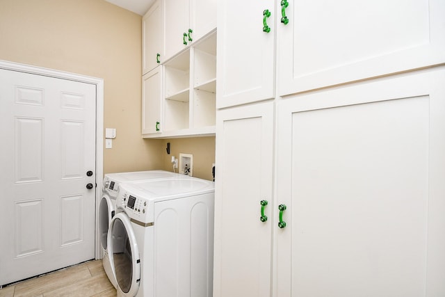 22602 Water Edge Ln, Katy, TX 77494 - washroom featuring separate washer and dryer, cabinet space, and light wood finished floors