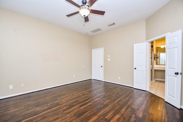 22602 Water Edge Ln, Katy, TX 77494 - unfurnished bedroom with dark wood-style flooring, ceiling fan, and connected bathroom