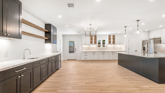 6414 Woodbrook Ln, Houston, TX 77008 - kitchen featuring stainless steel fridge with ice dispenser, decorative backsplash, recessed lighting, open shelves, and white cabinetry