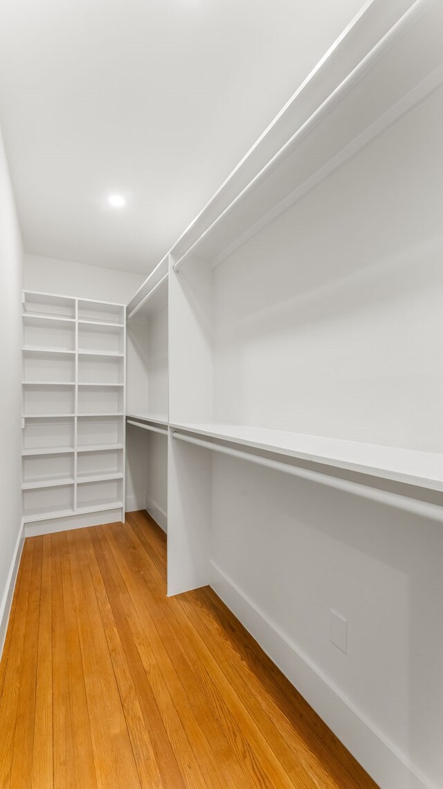 6414 Woodbrook Ln, Houston, TX 77008 - walk in closet with light wood finished floors