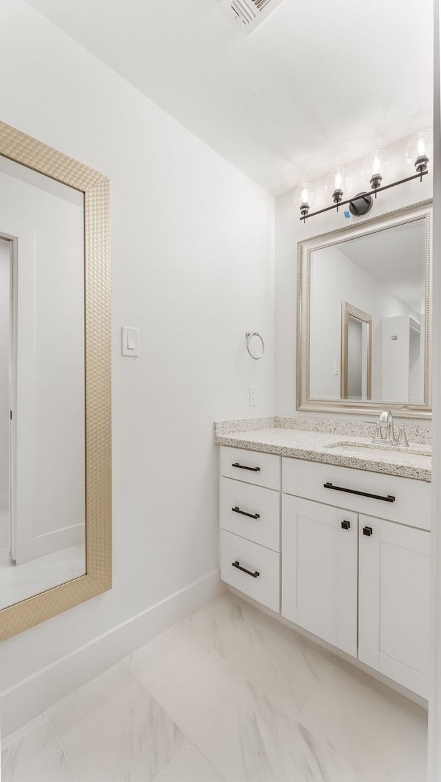 6414 Woodbrook Ln, Houston, TX 77008 - bathroom with vanity and marble look tile flooring