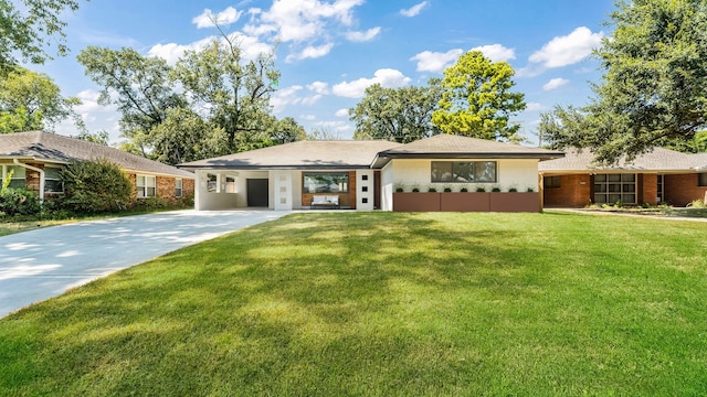 6414 Woodbrook Ln, Houston, TX 77008 - view of front of home with concrete driveway, a front lawn, an attached carport, and brick siding