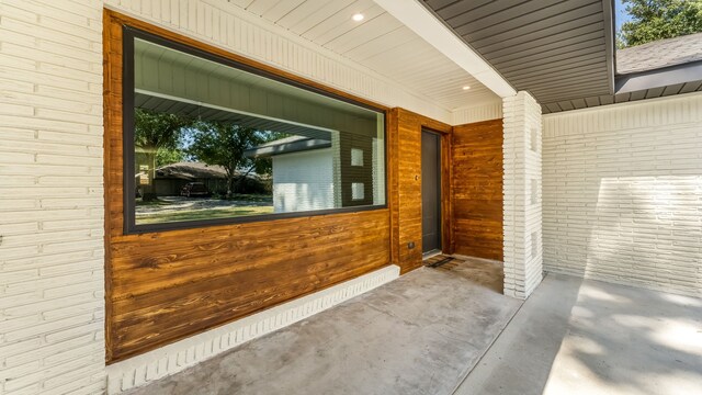6414 Woodbrook Ln, Houston, TX 77008 - view of exterior entry with a porch and brick siding