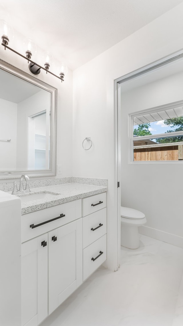 6414 Woodbrook Ln, Houston, TX 77008 - bathroom with vanity and marble look tile flooring