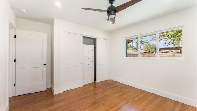 6414 Woodbrook Ln, Houston, TX 77008 - unfurnished bedroom featuring light wood-type flooring, a closet, and a ceiling fan