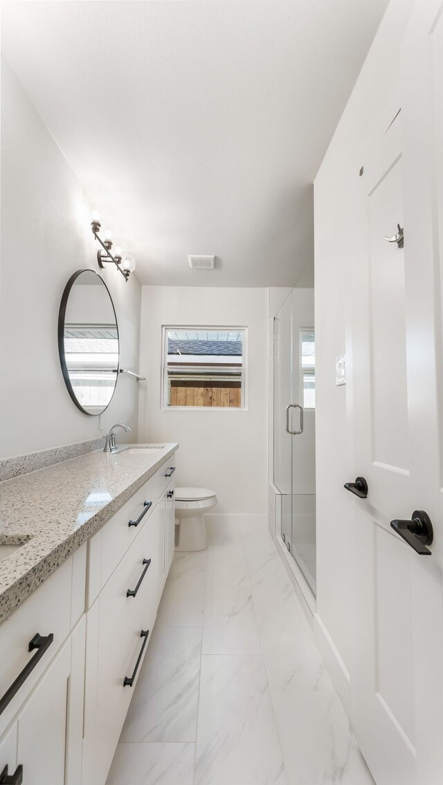 6414 Woodbrook Ln, Houston, TX 77008 - full bath featuring double vanity, marble look tiles, and a stall shower