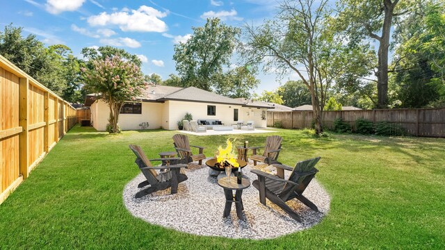 6414 Woodbrook Ln, Houston, TX 77008 - fenced backyard with an outdoor living space with a fire pit and a patio area