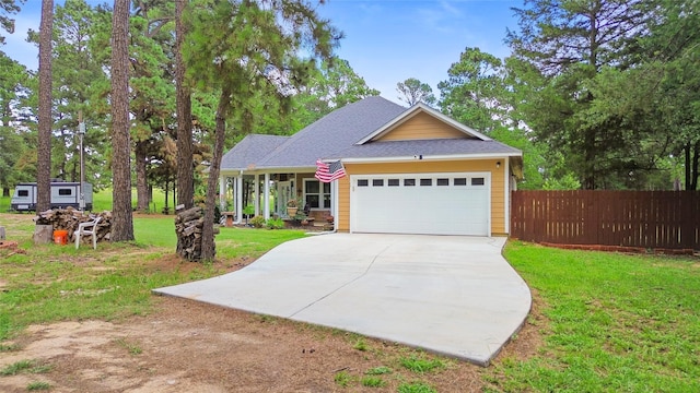 847 Cottletown Rd, Smithville, TX 78957 - view of front of house featuring concrete driveway, a garage, and a shingled roof