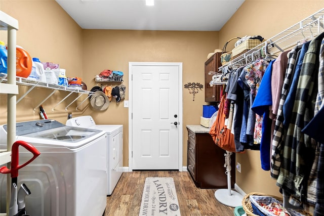 847 Cottletown Rd, Smithville, TX 78957 - washroom featuring washing machine and dryer and wood finished floors