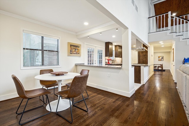 10707 Moonlight Dr, Houston, TX 77096 - dining space with dark wood-style flooring, stairs, ornamental molding, recessed lighting, and french doors