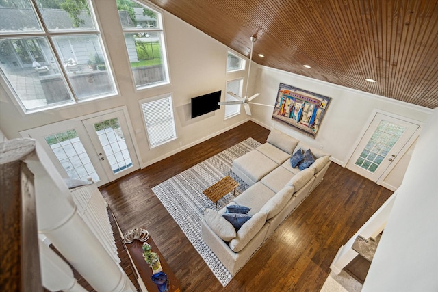 10707 Moonlight Dr, Houston, TX 77096 - living room featuring wood ceiling, french doors, healthy amount of natural light, wood finished floors, and a towering ceiling