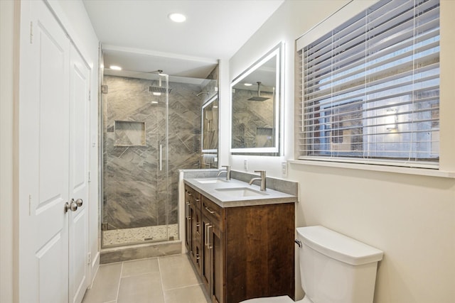 10707 Moonlight Dr, Houston, TX 77096 - bathroom with double vanity, a marble finish shower, recessed lighting, and tile patterned floors