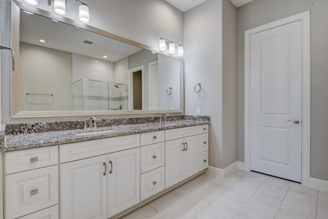 3207 Coach Horse Ln, Houston, TX 77080 - full bathroom featuring double vanity, a shower stall, and marble look tiles