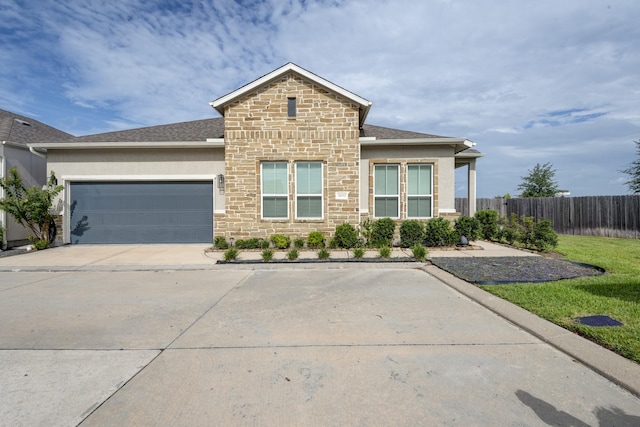 3207 Coach Horse Ln, Houston, TX 77080 - view of front of home featuring an attached garage, stone siding, stucco siding, and a shingled roof