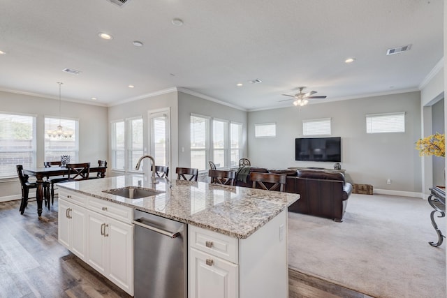 3207 Coach Horse Ln, Houston, TX 77080 - kitchen featuring dishwasher, plenty of natural light, an island with sink, light stone countertops, and recessed lighting