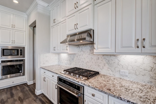 3207 Coach Horse Ln, Houston, TX 77080 - kitchen with stainless steel appliances, exhaust hood, crown molding, white cabinetry, and light stone countertops
