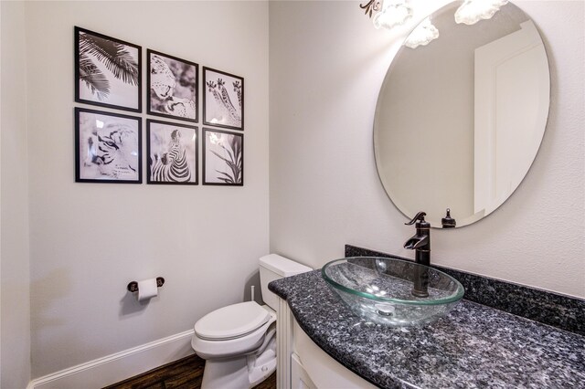 5531 Pine St Unit H, Houston, TX 77081 - half bath featuring vanity and wood finished floors