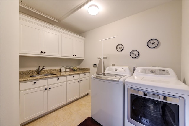5531 Pine St Unit H, Houston, TX 77081 - laundry room featuring washing machine and dryer and cabinet space